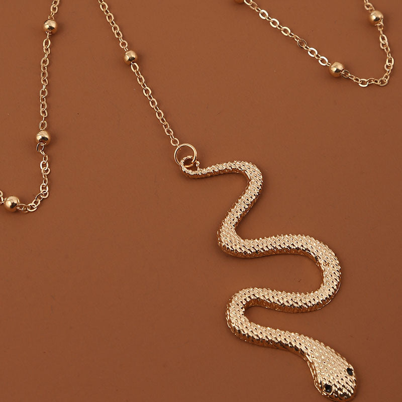 Bohemian Gold Beaded Thigh Chain with Snake Pendant – Women’s Body Jewellery